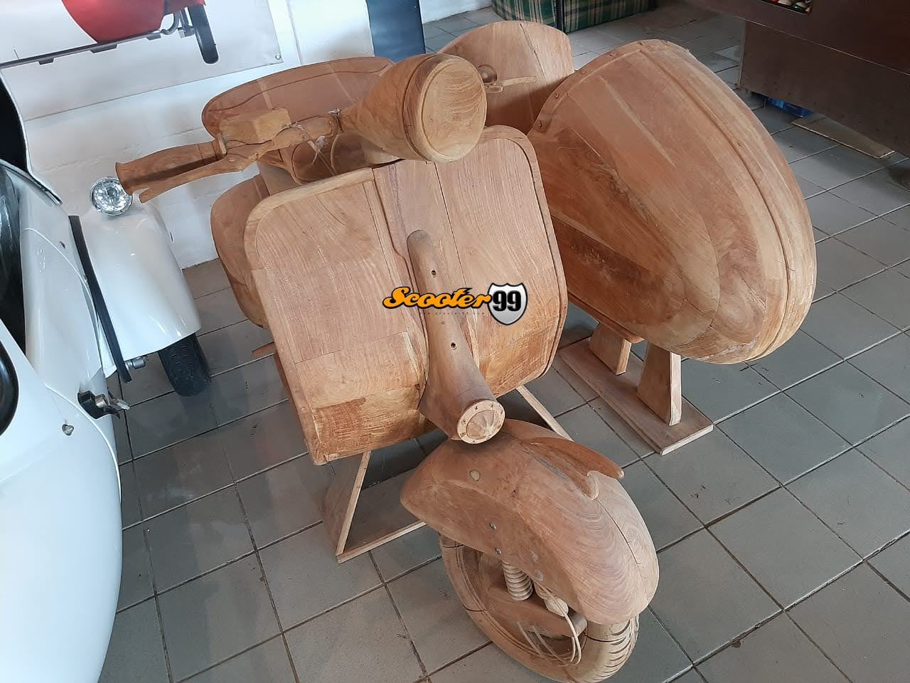 Hand-carved 1950s Vespa profile with streamlined sidecar